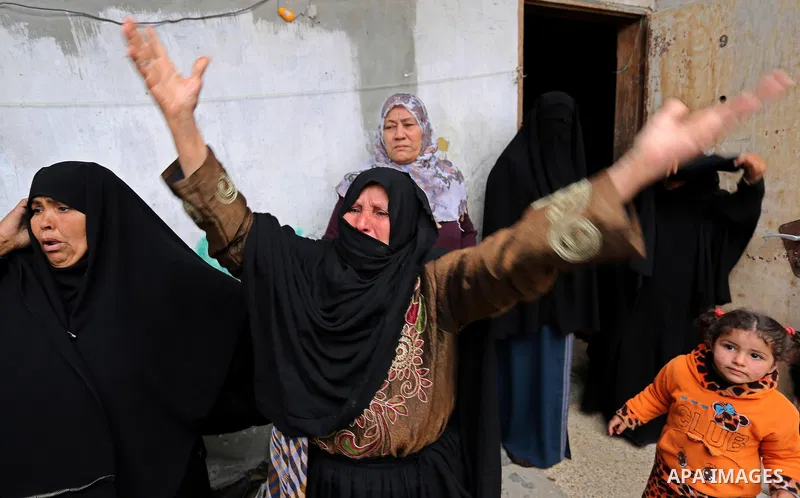 Relatives of Palestinian Youssef Abu Azra, who according to hospital officials was killed by Israeli fire and whom the Israeli forces said was detected with other suspects near the security fence, mourn during his funera...