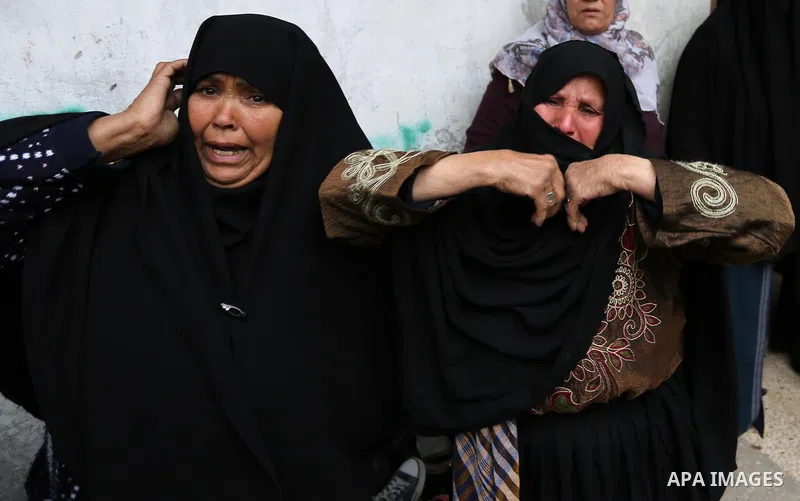Relatives of Palestinian Youssef Abu Azra, who according to hospital officials was killed by Israeli fire and whom the Israeli forces said was detected with other suspects near the security fence, mourn during his funera...