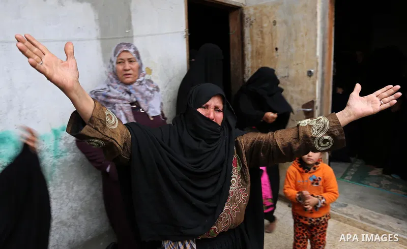 Relatives of Palestinian Youssef Abu Azra, who according to hospital officials was killed by Israeli fire and whom the Israeli forces said was detected with other suspects near the security fence, mourn during his funera...