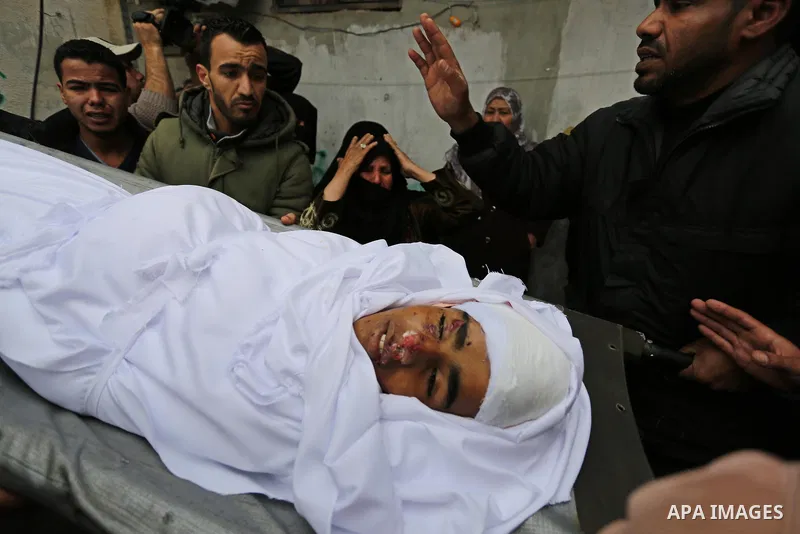 Mourners carry the body of Palestinian Youssef Abu Azra, who according to hospital officials was killed by Israeli fire and whom the Israeli forces said was detected with other suspects near the security fence, during hi...