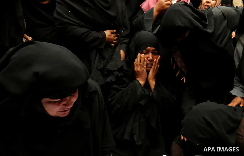 Relatives mourn around the body of Palestinian Youssef Abu Azra, who according to hospital officials was killed by Israeli fire and whom the Israeli forces said was detected with other suspects near the security fence, d...