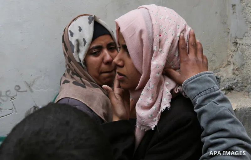 Relatives of Palestinian Youssef Abu Azra, who according to hospital officials was killed by Israeli fire and whom the Israeli forces said was detected with other suspects near the security fence, mourn during his funera...