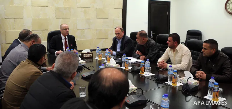Palestinian Prime Minister Rami al-Hamdallah meets with Regulatory Authority for Qalandiya Camp , in the West Bank city of Ramallah on March 23 2017. Photo by Prime Minister Office