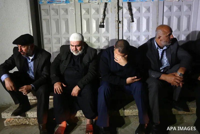 Relatives of Hamas official, Mazen Faqha who was shot dead by gunmen in the Gaza Strip mourn outside the hospital morgue in Gaza City on March 24, 2017. Faqha was released along with more than 1,000 other Palestinians in...