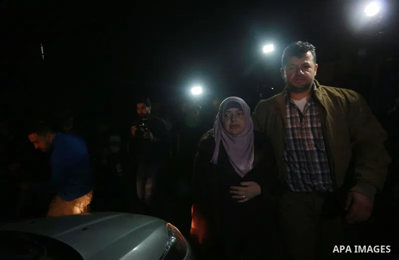 Nahid Asida, wife of Hamas official, Mazen Faqha who was shot dead by gunmen in the Gaza Strip arrives at a hospital morgue in Gaza City on March 24, 2017. Faqha was released along with more than 1,000 other Palestinians...