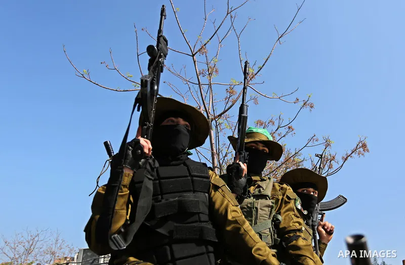 Members of the Ezzedine al-Qassam Brigades, the military wing of the Palestinian Islamist movement Hamas take part in the funeral of Hamas official, Mazen Faqha who was freed by Israel in a 2011 prisoner swap in Gaza Cit...