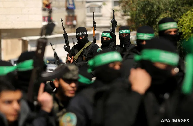 Members of the Ezzedine al-Qassam Brigades, the military wing of the Palestinian Islamist movement Hamas take part in the funeral of Hamas official, Mazen Faqha who was freed by Israel in a 2011 prisoner swap in Gaza Cit...