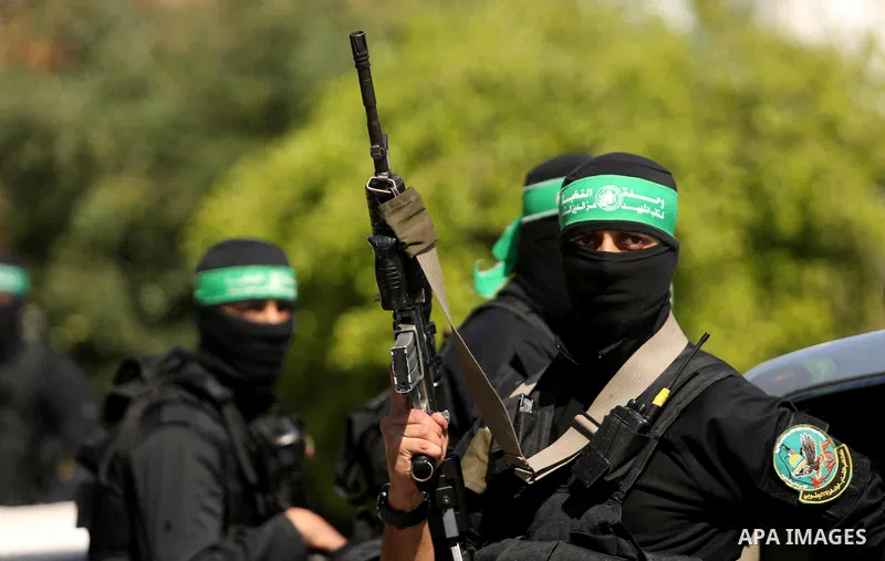 Members of the Ezzedine al-Qassam Brigades, the military wing of the Palestinian Islamist movement Hamas take part in the funeral of Hamas official, Mazen Faqha who was freed by Israel in a 2011 prisoner swap in Gaza Cit...