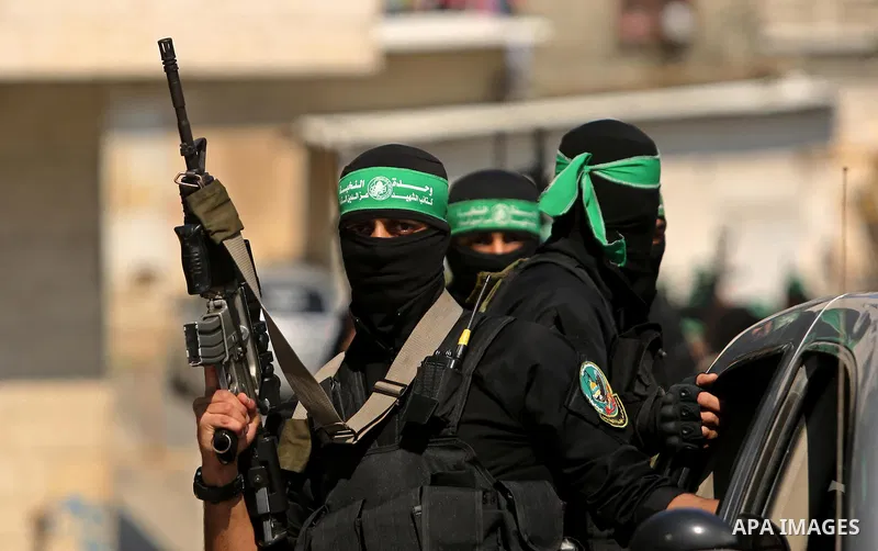 Members of the Ezzedine al-Qassam Brigades, the military wing of the Palestinian Islamist movement Hamas take part in the funeral of Hamas official, Mazen Faqha who was freed by Israel in a 2011 prisoner swap in Gaza Cit...