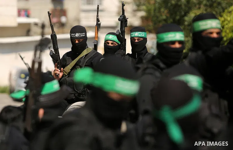Members of the Ezzedine al-Qassam Brigades, the military wing of the Palestinian Islamist movement Hamas take part in the funeral of Hamas official, Mazen Faqha who was freed by Israel in a 2011 prisoner swap in Gaza Cit...