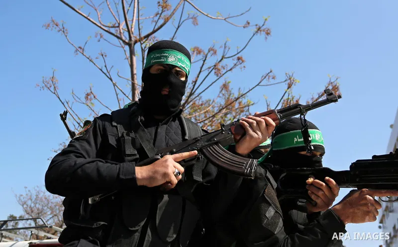Members of the Ezzedine al-Qassam Brigades, the military wing of the Palestinian Islamist movement Hamas take part in the funeral of Hamas official, Mazen Faqha who was freed by Israel in a 2011 prisoner swap in Gaza Cit...