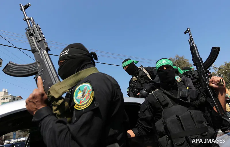 Members of the Ezzedine al-Qassam Brigades, the military wing of the Palestinian Islamist movement Hamas take part in the funeral of Hamas official, Mazen Faqha who was freed by Israel in a 2011 prisoner swap in Gaza Cit...