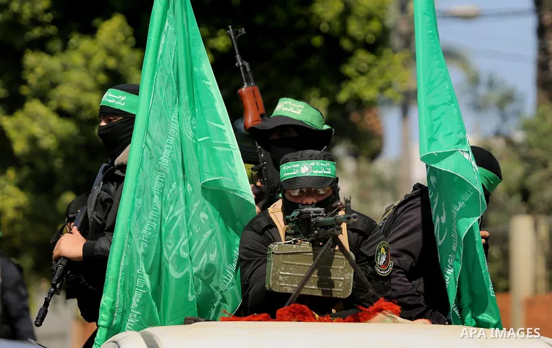 Members of the Ezzedine al-Qassam Brigades, the military wing of the Palestinian Islamist movement Hamas take part in the funeral of Hamas official, Mazen Faqha who was freed by Israel in a 2011 prisoner swap in Gaza Cit...