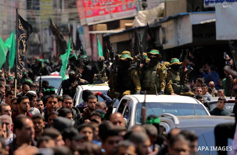 Members of the Ezzedine al-Qassam Brigades, the military wing of Hamas take part in the funeral of Palestinian Islamist movement Hamas' official Mazen Faqha, in Gaza city on March 25, 2017. Gunmen in the Gaza Strip had s...