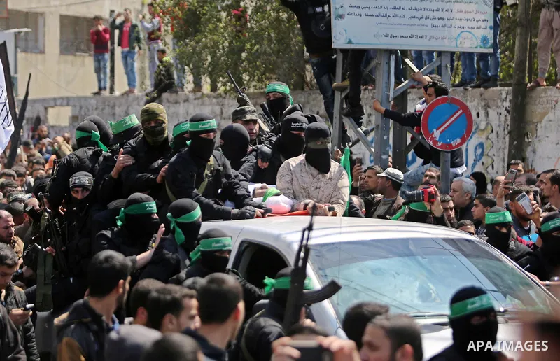Members of the Ezzedine al-Qassam Brigades, the military wing of Hamas take part in the funeral of Palestinian Islamist movement Hamas' official Mazen Faqha, in Gaza city on March 25, 2017. Gunmen in the Gaza Strip had s...