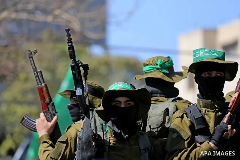 Members of the Ezzedine al-Qassam Brigades, the military wing of Hamas take part in the funeral of Palestinian Islamist movement Hamas' official Mazen Faqha, in Gaza city on March 25, 2017. Gunmen in the Gaza Strip had s...