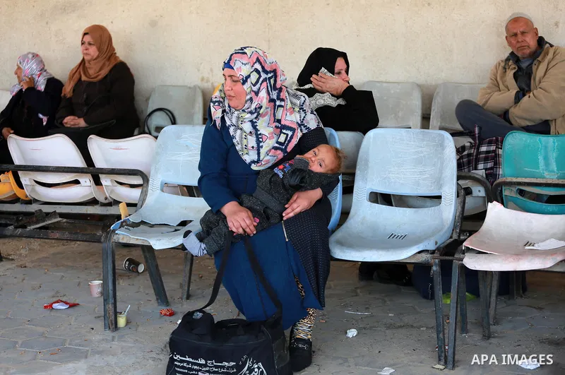 Palestinians wait at Erez border crossing into Israel, in Beit Hanun, in the northern Gaza Strip on March 26, 2017, after it was shut by the Islamist movement after blaming the Jewish state for the assassination of one o...