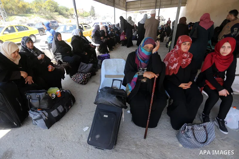 Palestinians wait at Erez border crossing into Israel, in Beit Hanun, in the northern Gaza Strip on March 26, 2017, after it was shut by the Islamist movement after blaming the Jewish state for the assassination of one o...