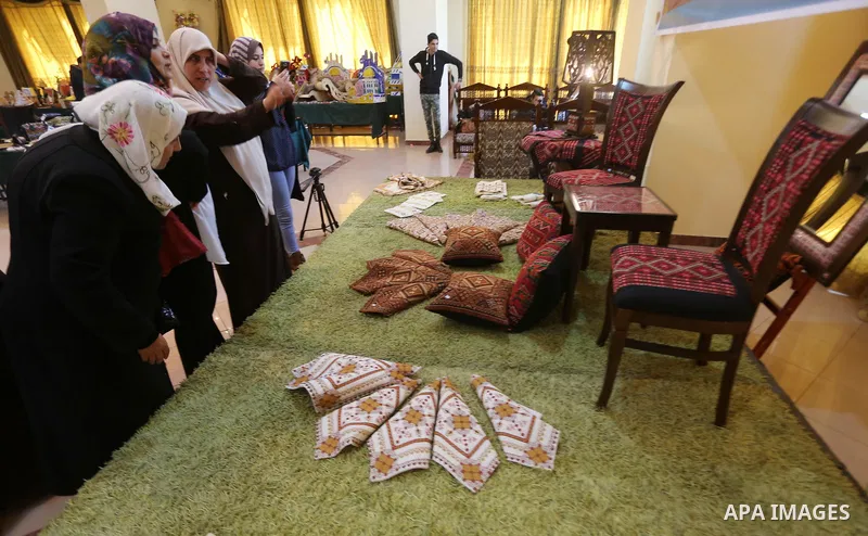Palestinian Female prisoners take part in an exhibition of art works and handicrafts products organized by the Ministry of Interior, in Gaza city on March 26, 2016. Photo by Mohammed Asad