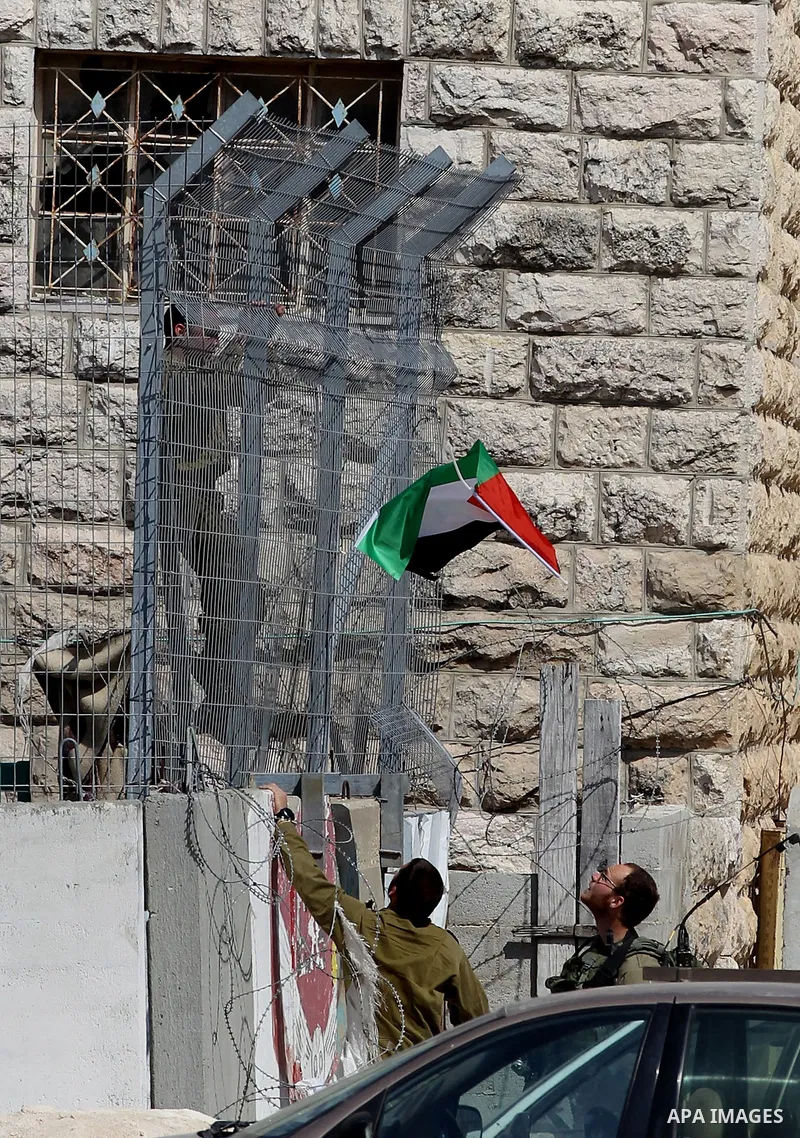 Israeli soldiers take position during a protest by Palestinian demonstrators against Jewish settlements in the West Bank city of Hebron March 26, 2017. Photo by Wisam Hashlamoun