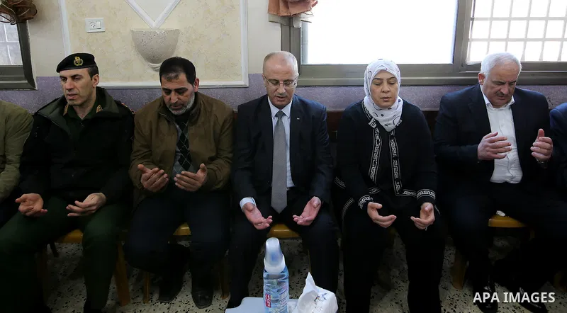 Palestinian Prime Minister Rami Hamdallah offers his condolences for the family of Mohammed Hattab who was shot dead by Israeli security forces at the al-Jalazun refugee camp, near the West Bank city of Ramallah, on Marc...