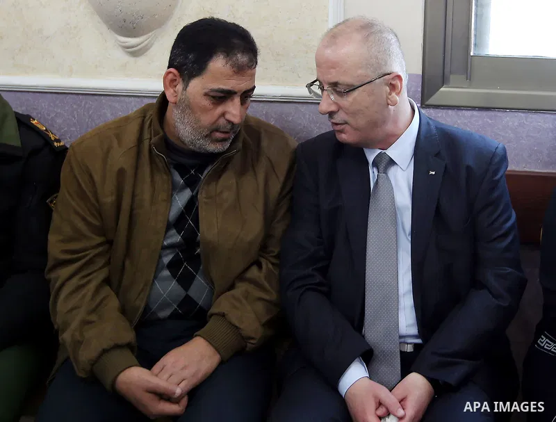 Palestinian Prime Minister Rami Hamdallah offers his condolences for the family of Mohammed Hattab who was shot dead by Israeli security forces at the al-Jalazun refugee camp, near the West Bank city of Ramallah, on Marc...