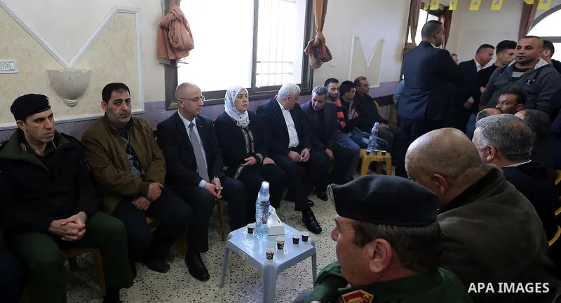 Palestinian Prime Minister Rami Hamdallah offers his condolences for the family of Mohammed Hattab who was shot dead by Israeli security forces at the al-Jalazun refugee camp, near the West Bank city of Ramallah, on Marc...