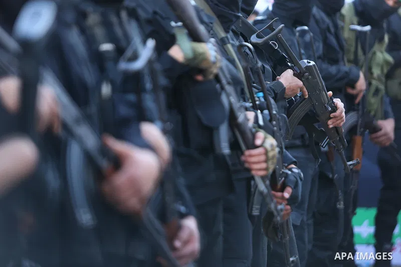 Members of the Ezzedine al-Qassam Brigades, the military wing of the Palestinian Islamist movement Hamas take part in condolences of Hamas official, Mazen Faqha who was freed by Israel in a 2011 prisoner swap after shot...