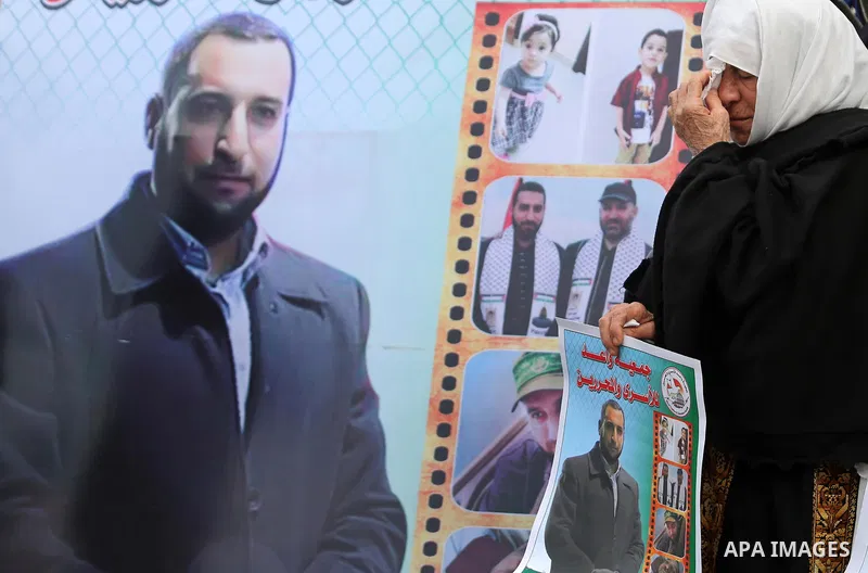 Palestinians take part during a protest denouncing an assassination of Hamas official, Mazen Faqha who was freed by Israel in a 2011 prisoner swap after he was shot dead by unknown gunmen, in front of Red cross office in...