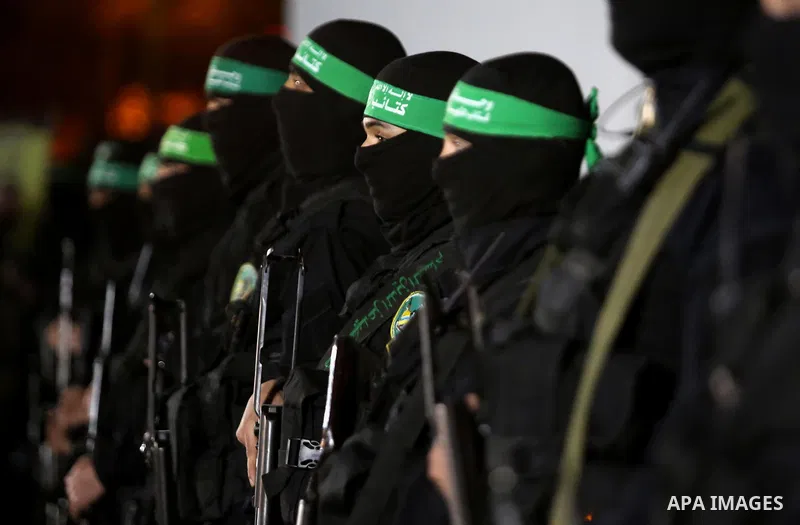 Members of the Ezzedine al-Qassam Brigades, the military wing of the Palestinian Islamist movement Hamas take part in a memorial service of Hamas official, Mazen Faqha, who was shot dead by unknown gunmen, in Gaza city o...