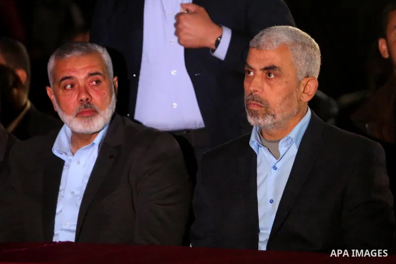 Yahya Sinwar, the new leader of Hamas in the Gaza Strip and senior political leaders of the Islamist movement, Ismail Haniyeh attend a memorial service of Hamas official, Mazen Faqha, who was shot dead by unknown gunmen,...