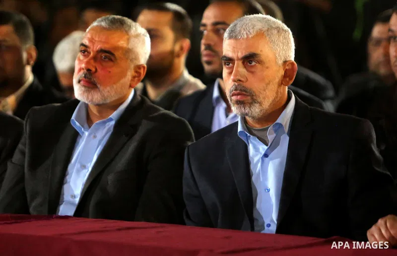 Yahya Sinwar, the new leader of Hamas in the Gaza Strip and senior political leaders of the Islamist movement, Ismail Haniyeh attend a memorial service of Hamas official, Mazen Faqha, who was shot dead by unknown gunmen,...