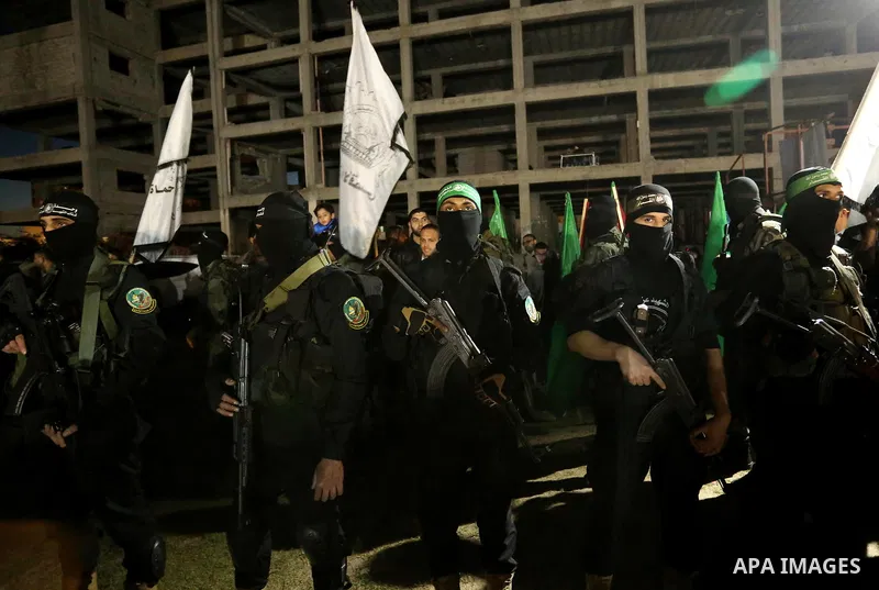 Members of the Ezzedine al-Qassam Brigades, the military wing of the Palestinian Islamist movement Hamas take part in a memorial service of Hamas official, Mazen Faqha, who was shot dead by unknown gunmen, in Gaza city o...