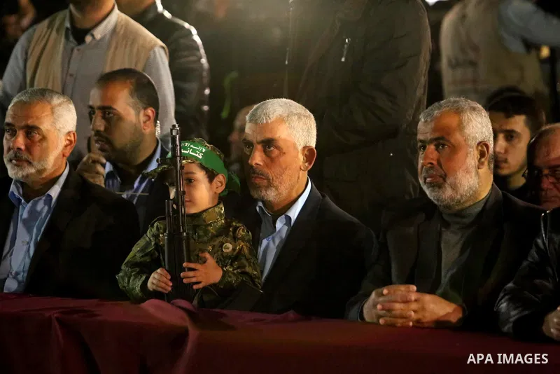 Yahya Sinwar, the new leader of Hamas in the Gaza Strip and senior political leaders of the Islamist movement, Ismail Haniyeh attend a memorial service of Hamas official, Mazen Faqha, who was shot dead by unknown gunmen,...