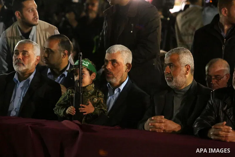 Yahya Sinwar, the new leader of Hamas in the Gaza Strip and senior political leaders of the Islamist movement, Ismail Haniyeh attend a memorial service of Hamas official, Mazen Faqha, who was shot dead by unknown gunmen,...