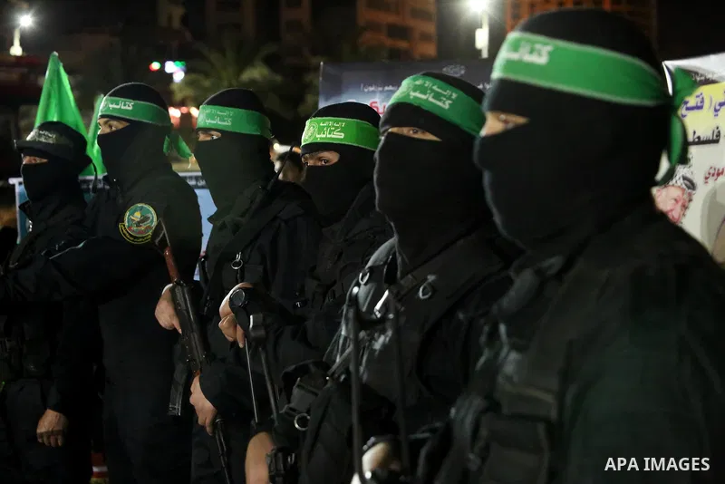 Members of the Ezzedine al-Qassam Brigades, the military wing of the Palestinian Islamist movement Hamas take part in a memorial service of Hamas official, Mazen Faqha, who was shot dead by unknown gunmen, in Gaza city o...