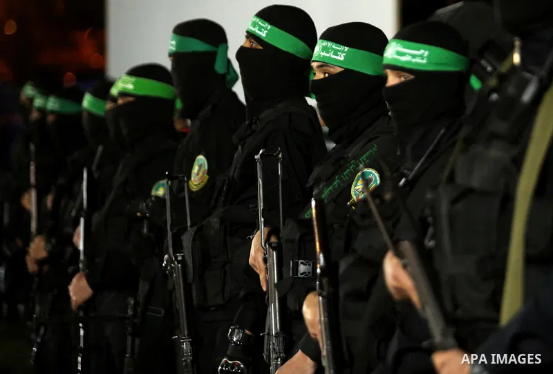 Members of the Ezzedine al-Qassam Brigades, the military wing of the Palestinian Islamist movement Hamas take part in a memorial service of Hamas official, Mazen Faqha, who was shot dead by unknown gunmen, in Gaza city o...