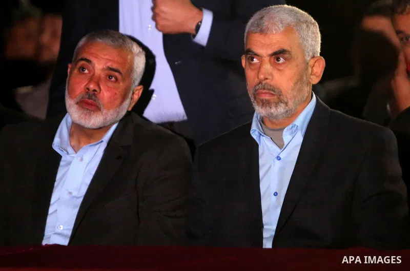 Yahya Sinwar, the new leader of Hamas in the Gaza Strip and senior political leaders of the Islamist movement, Ismail Haniyeh attend a memorial service of Hamas official, Mazen Faqha, who was shot dead by unknown gunmen,...
