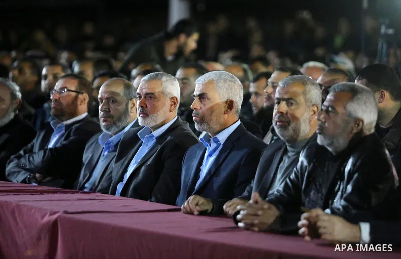 Yahya Sinwar, the new leader of Hamas in the Gaza Strip and senior political leaders of the Islamist movement, Ismail Haniyeh attend a memorial service of Hamas official, Mazen Faqha, who was shot dead by unknown gunmen,...