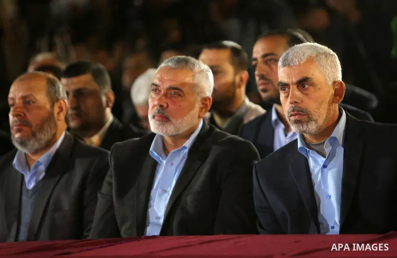 Yahya Sinwar, the new leader of Hamas in the Gaza Strip and senior political leaders of the Islamist movement, Ismail Haniyeh attend a memorial service of Hamas official, Mazen Faqha, who was shot dead by unknown gunmen,...