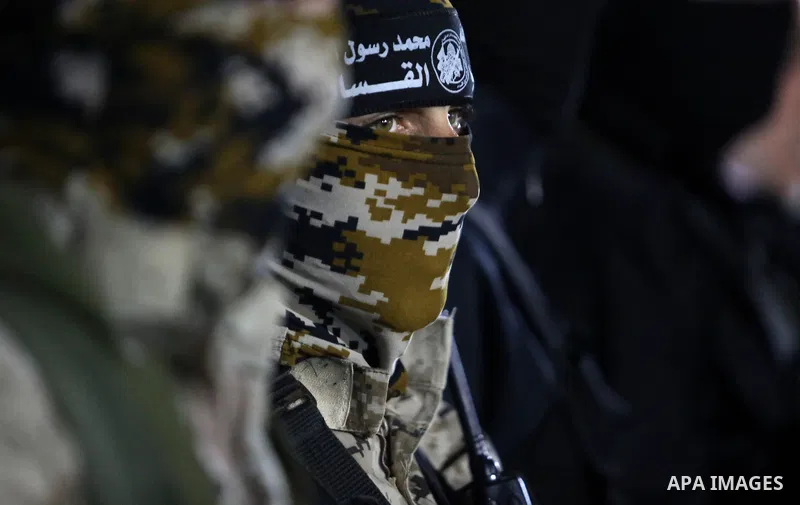 Members of the Ezzedine al-Qassam Brigades, the military wing of the Palestinian Islamist movement Hamas take part in a memorial service of Hamas official, Mazen Faqha, who was shot dead by unknown gunmen, in Gaza city o...
