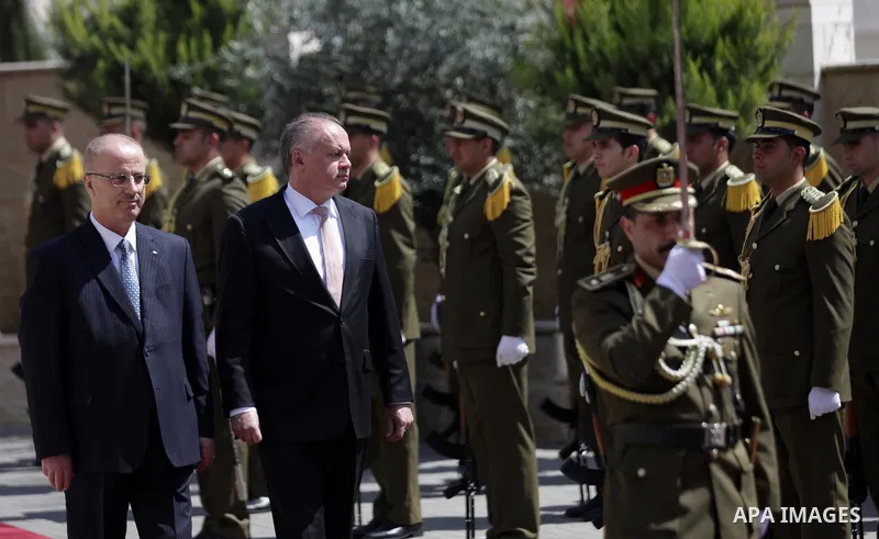 Palestinian Prime Minister Rami Hamdallah and Slovak President Andrej Kiska review the honour guard ahead of their meeting in the West Bank city of Ramallah on March 28, 2017. apaimages/Fadi Arouri/Pool