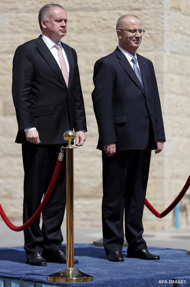 Palestinian Prime Minister Rami Hamdallah and Slovak President Andrej Kiska review the honour guard ahead of their meeting in the West Bank city of Ramallah on March 28, 2017. apaimages/Fadi Arouri/Pool
