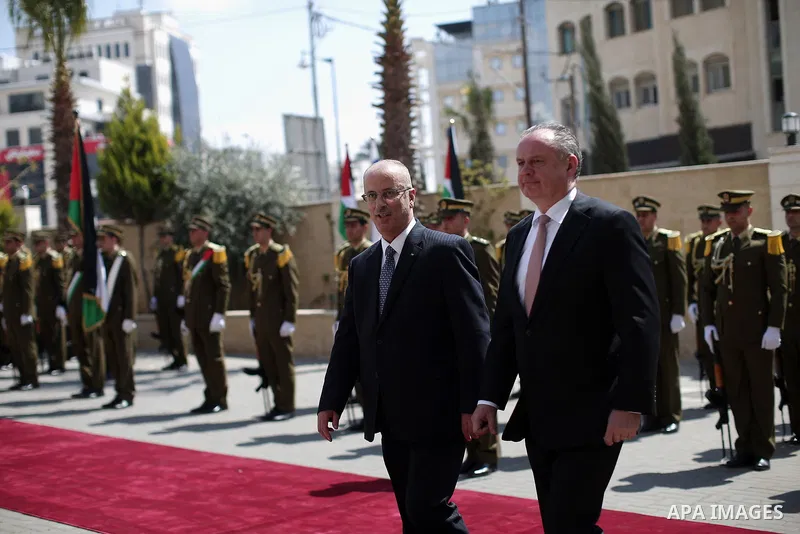 Palestinian Prime Minister Rami Hamdallah and Slovak President Andrej Kiska review the honour guard ahead of their meeting in the West Bank city of Ramallah on March 28, 2017. apaimages/Fadi Arouri/Pool