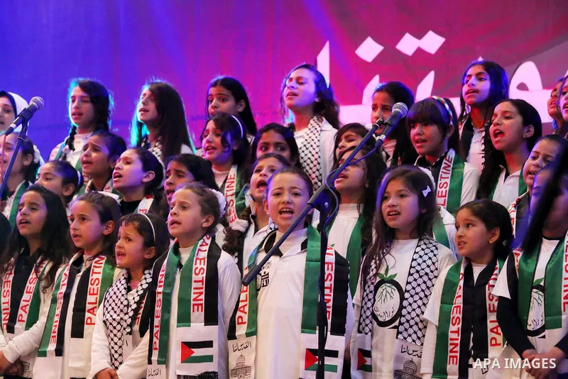Palestinian children perform during a festival titled "our land..our identity" marking the Land day in Gaza city on March 29, 2017. Photo by Ashraf Amra