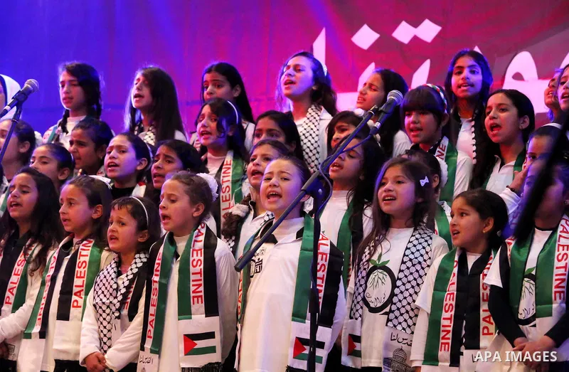 Palestinian children perform during a festival titled "our land..our identity" marking the Land day in Gaza city on March 29, 2017. Photo by Ashraf Amra