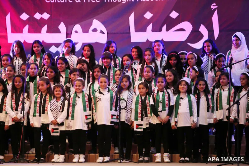Palestinian children perform during a festival titled "our land..our identity" marking the Land day in Gaza city on March 29, 2017. Photo by Ashraf Amra