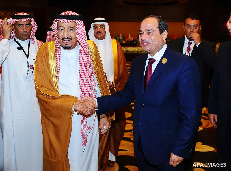 Egypt's President Abdel Fattah al-Sisi shakes hands with Saudi Arabia's King Salman bin Abdulaziz al-Saud, on the sideline of the 28th Summit of the Arab League at the Dead Sea, Jordan March 29, 2017. Photo by Egyptian P...