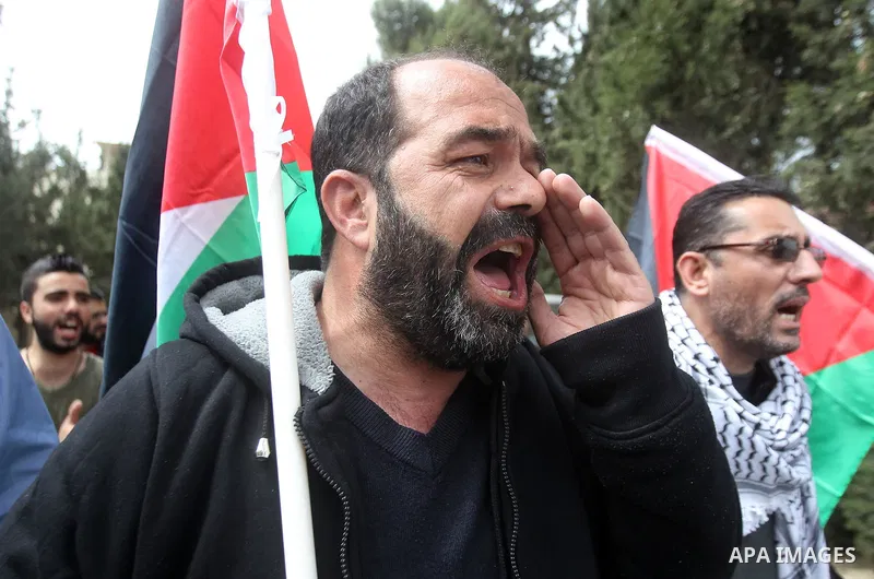 Palestinians hold Palestine flags during a demonstration marking Land Day, in the West Bank city of Beit Jala March 30, 2017. March 30 marks Land Day, the annual commemorations of the killing by police of six Arab citize...