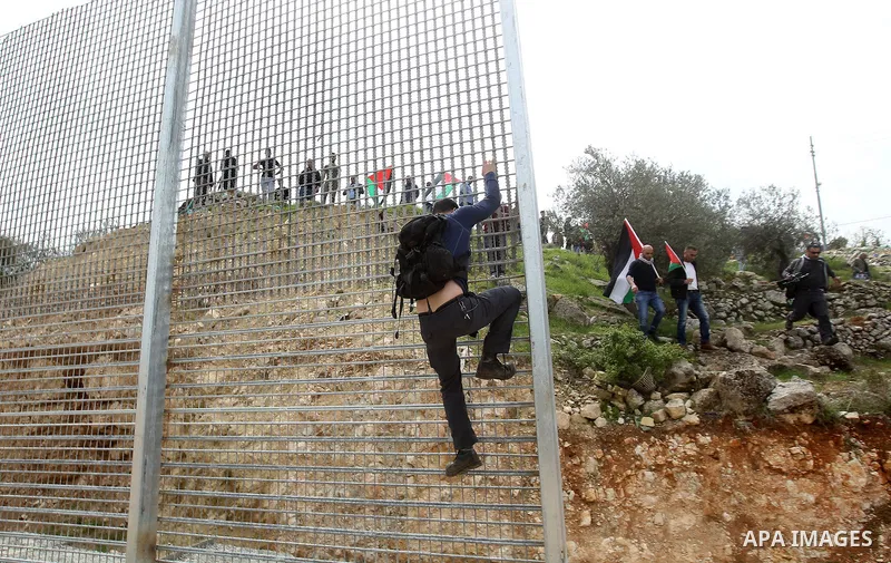 Palestinians hold Palestine flags during a demonstration marking Land Day, in the West Bank city of Beit Jala March 30, 2017. March 30 marks Land Day, the annual commemorations of the killing by police of six Arab citize...